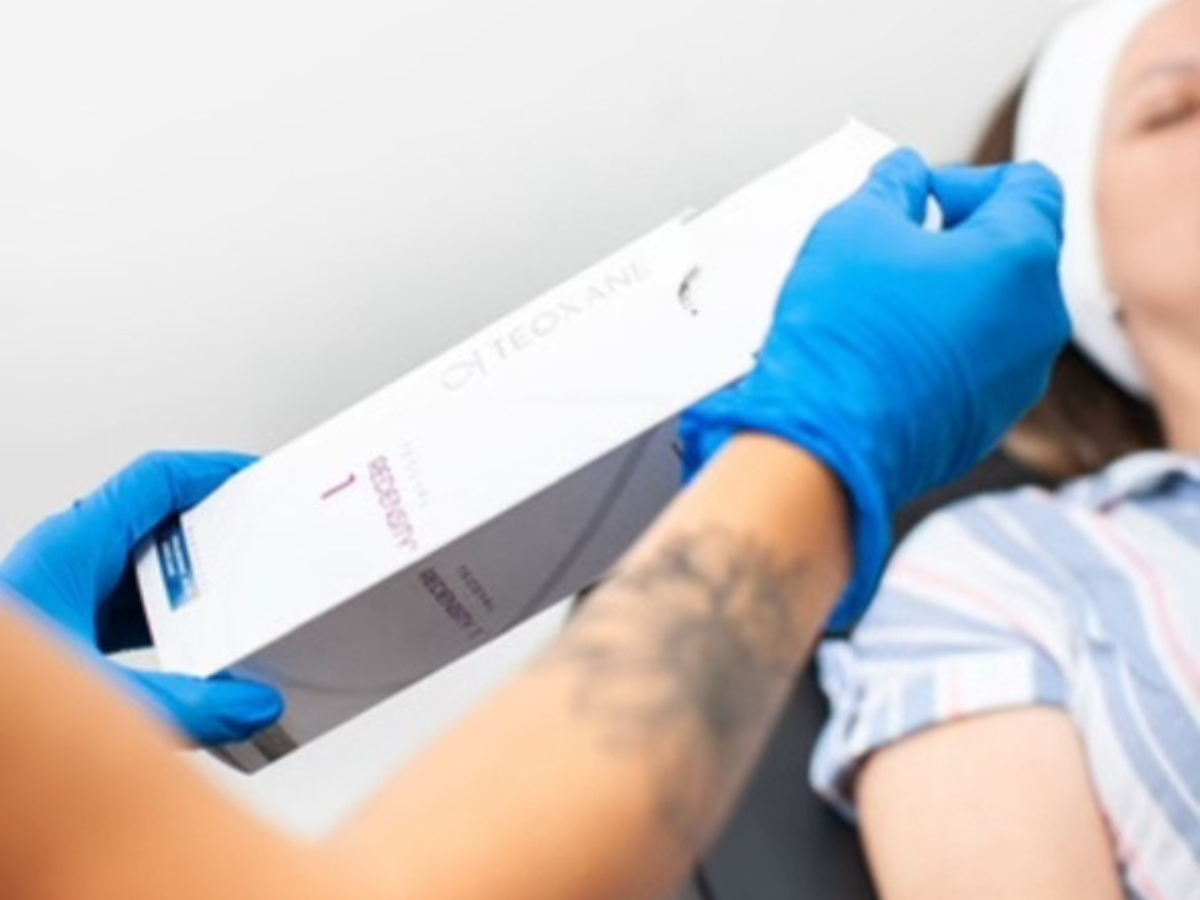 Nurse holding a box of skin booster